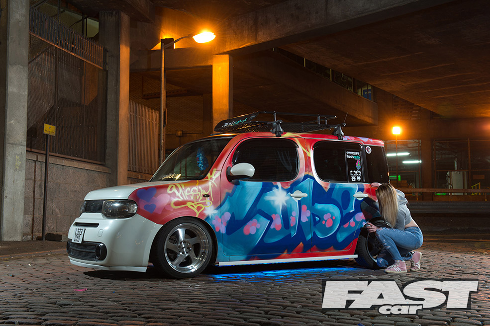 modified Nissan Cube with neon underglow