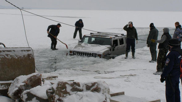 Hummers fall through ice 